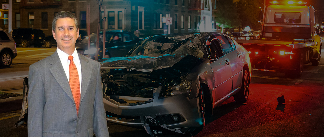 Casey William Stevens with a car accident in the background